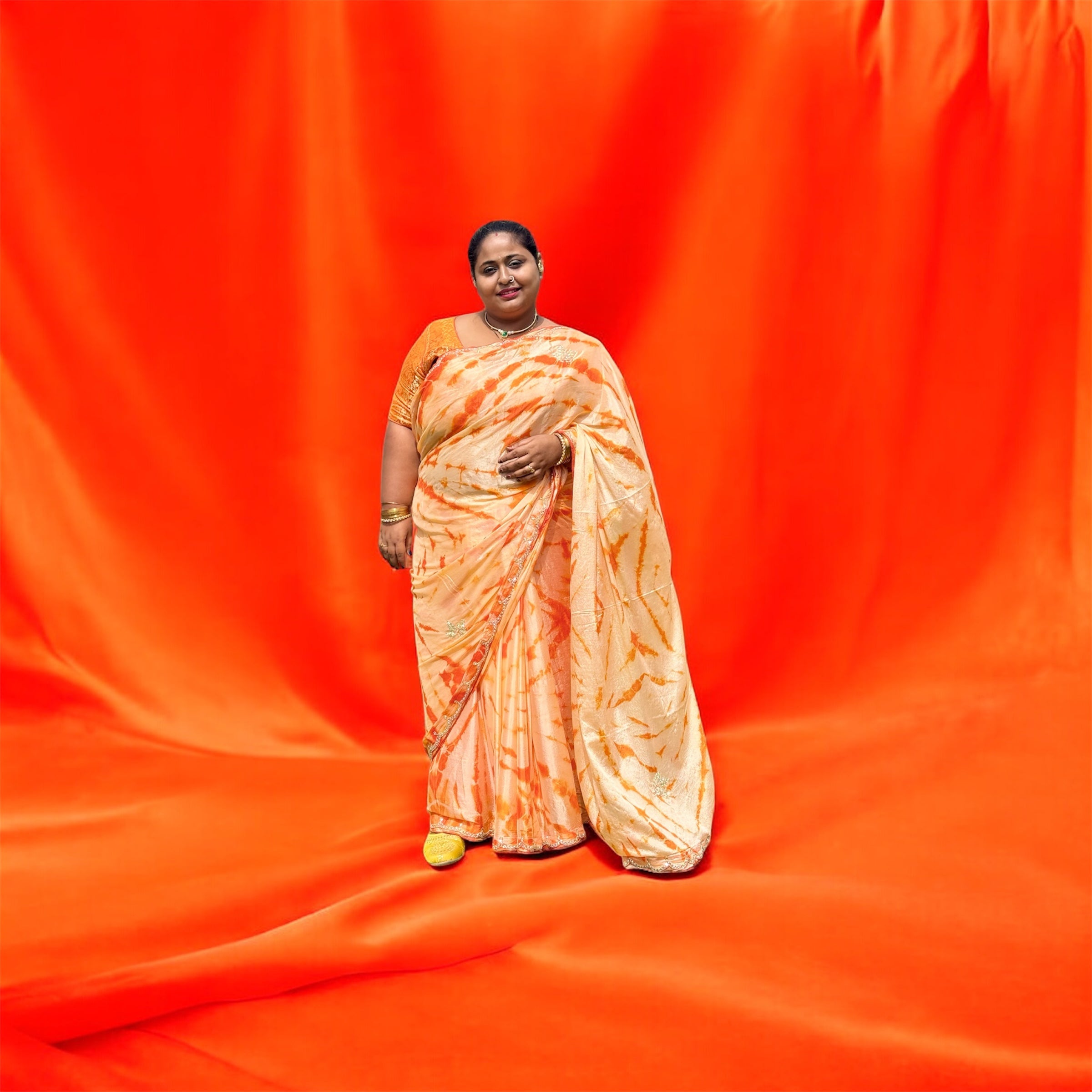 Sunlit Radiance – Orange Tie-Dye Saree with Embellished Border